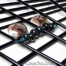 Black metallic rods and beads