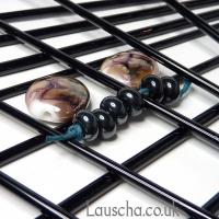 Black metallic rods and beads